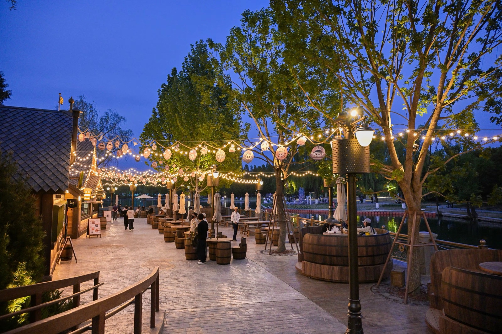 Lantern-lit street in the park at dusk